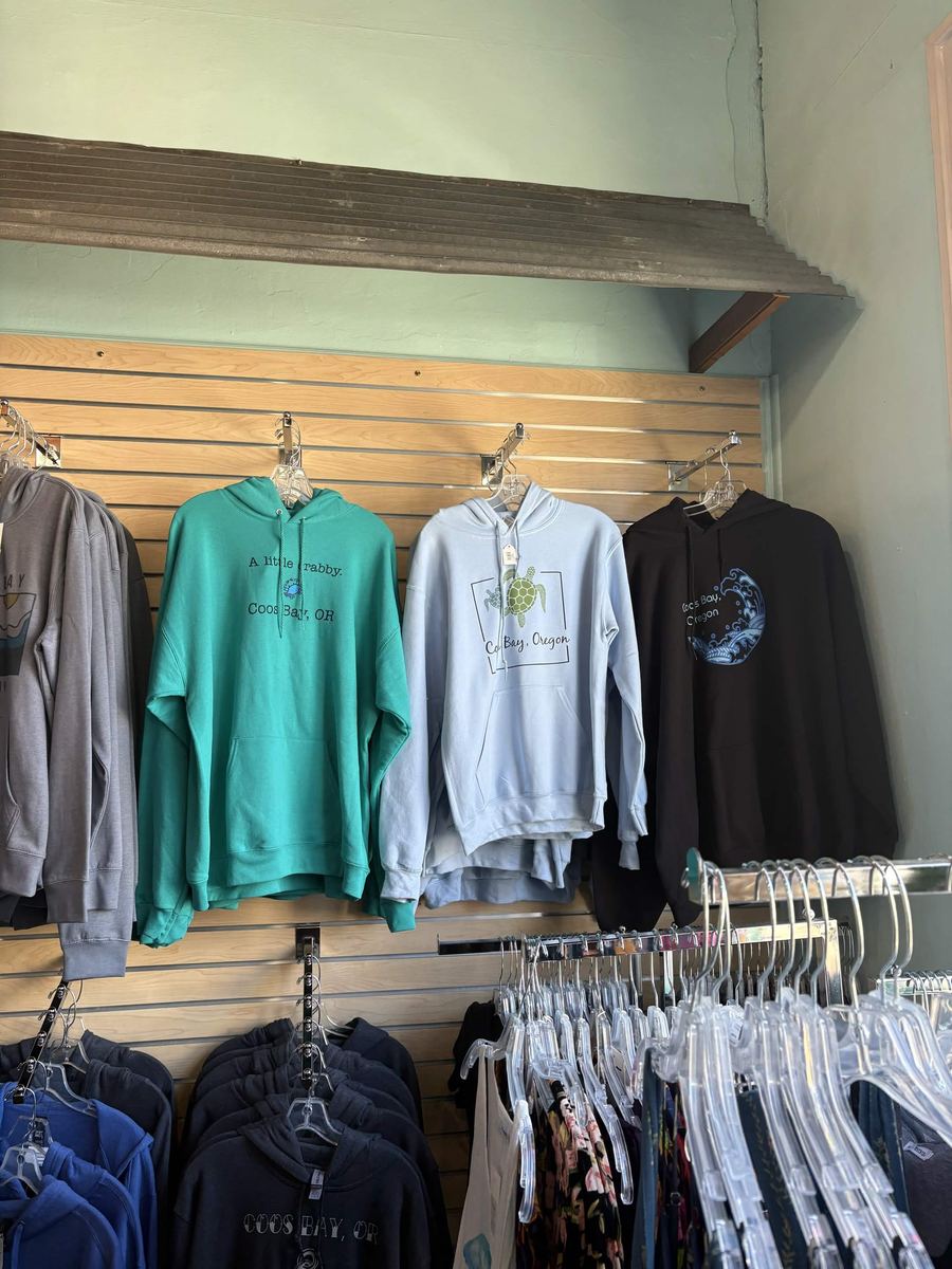 Coos Bay hoodies including a teal a little crabby design and a sea turtle print